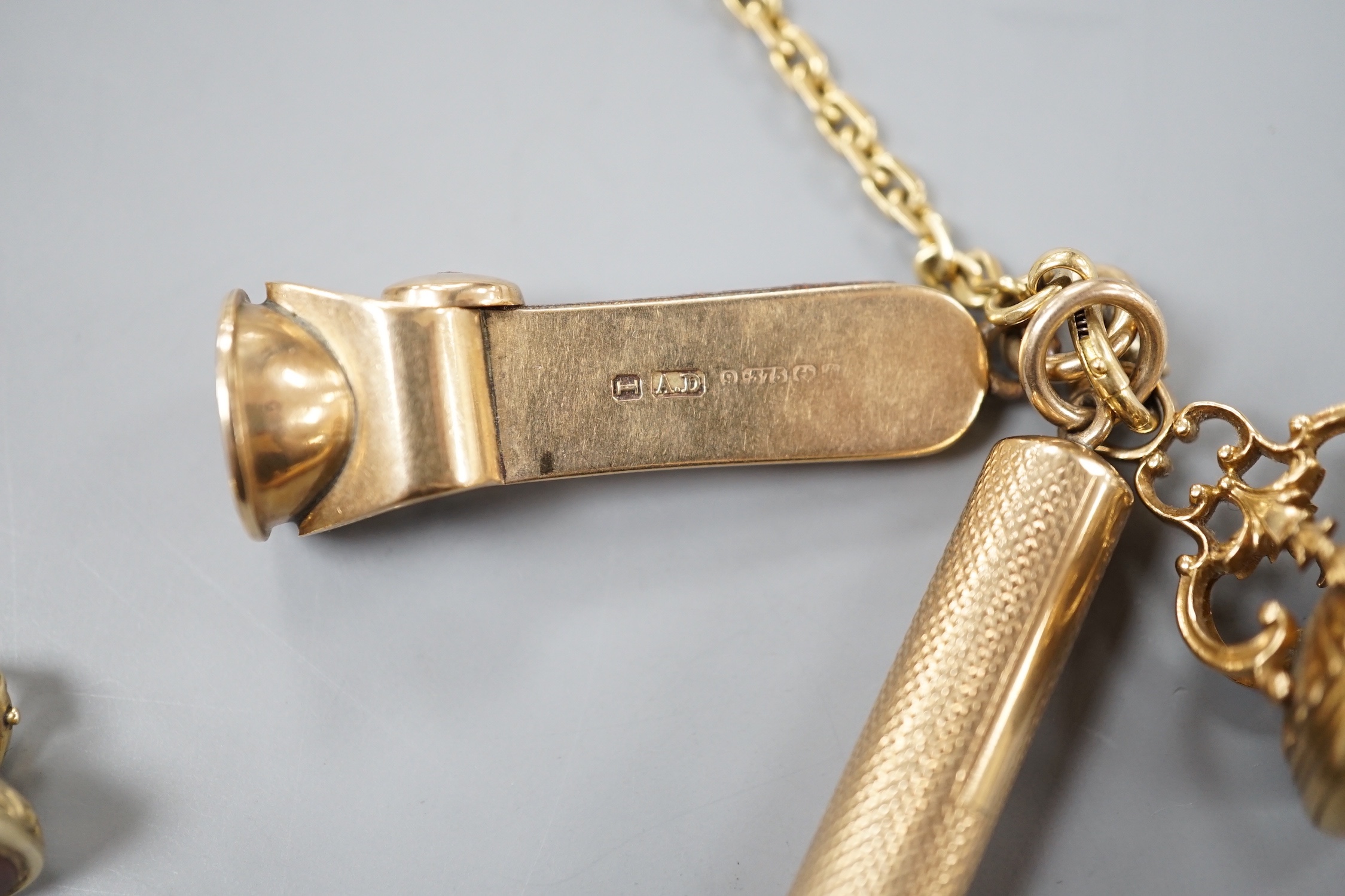 An 18ct albert chain, 33cm, 15 grams, hung with two 19th century yellow metal overlaid and carnelian fob seals, a yellow metal overlaid propelling pencil and a 9ct gold mounted cigar cutter.